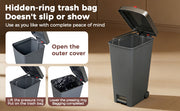 Gray trash bin with step-on lid mechanism on a wooden floor.