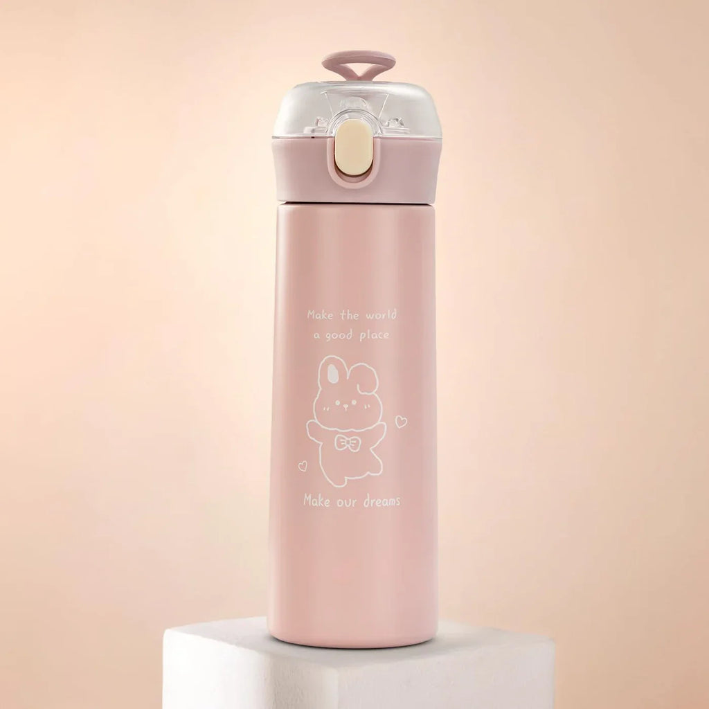 Pink water bottle with a cartoon design on a light pink background