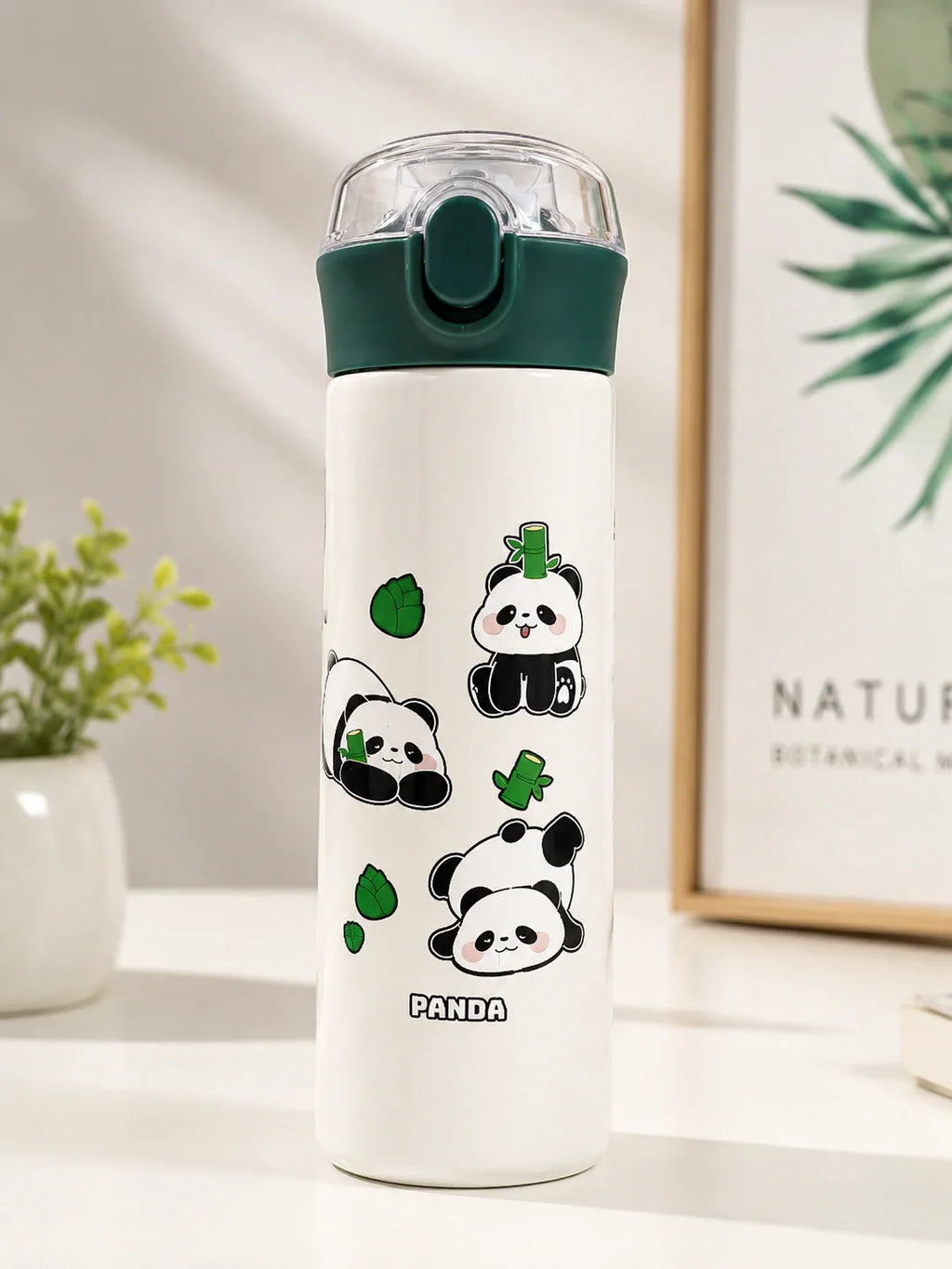 White water bottle with panda designs on a white surface