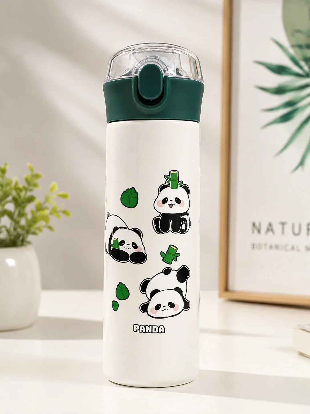 White water bottle with panda designs on a white surface