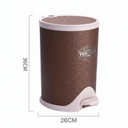 Brown trash bin with white pedal on a white background, featuring dimensions.