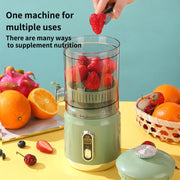 Blender with fruits on a yellow surface and blue background