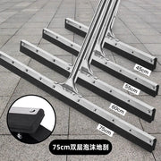 Set of squeegees with different sizes on a tiled floor